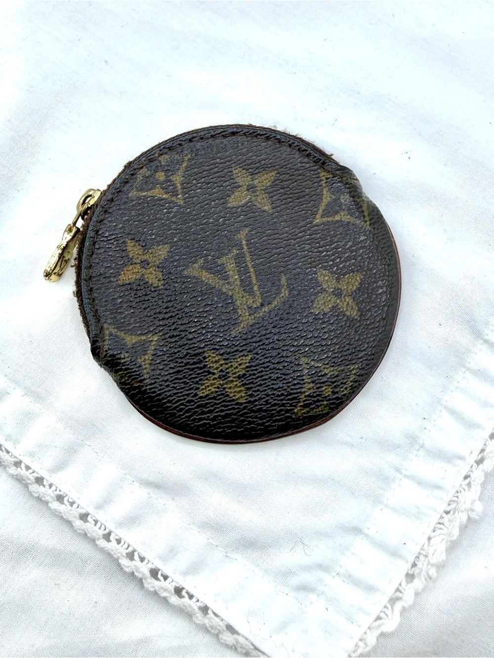 Authentic Louis Vuitton coin case.  Monogram pattern.